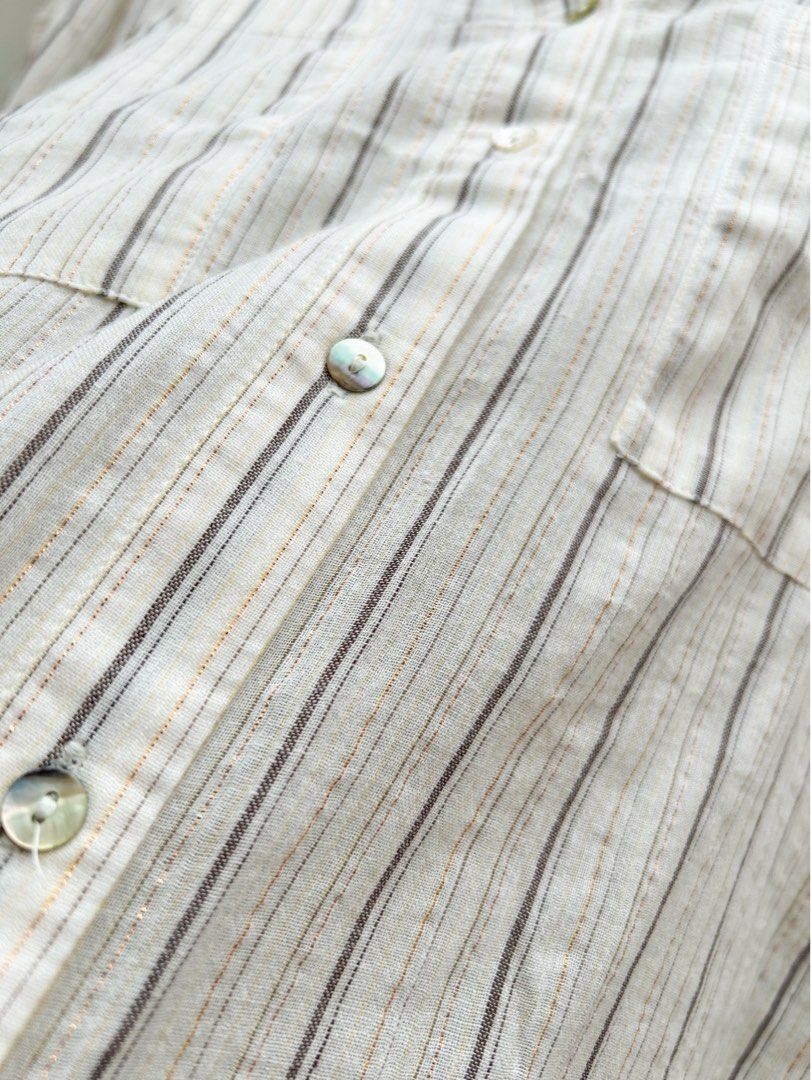 MNG Linen Blend Striped Polo (Category: Longsleeves) located in Cainta. Submitted by unboxingstuff (Listing ID 1461286664, Image 3). Description: - MNG cream and grey striped linen polo - Subtle metallic threads woven in - Two chest pockets with button closure - Button-up front - Brand new with tag attached - Ideal for casual wear - Measurements available in photos.