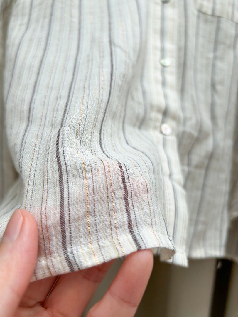 MNG Linen Blend Striped Polo (Category: Longsleeves) located in Cainta. Submitted by unboxingstuff (Listing ID 1461286664, Image 2). Description: - MNG cream and grey striped linen polo - Subtle metallic threads woven in - Two chest pockets with button closure - Button-up front - Brand new with tag attached - Ideal for casual wear - Measurements available in photos.