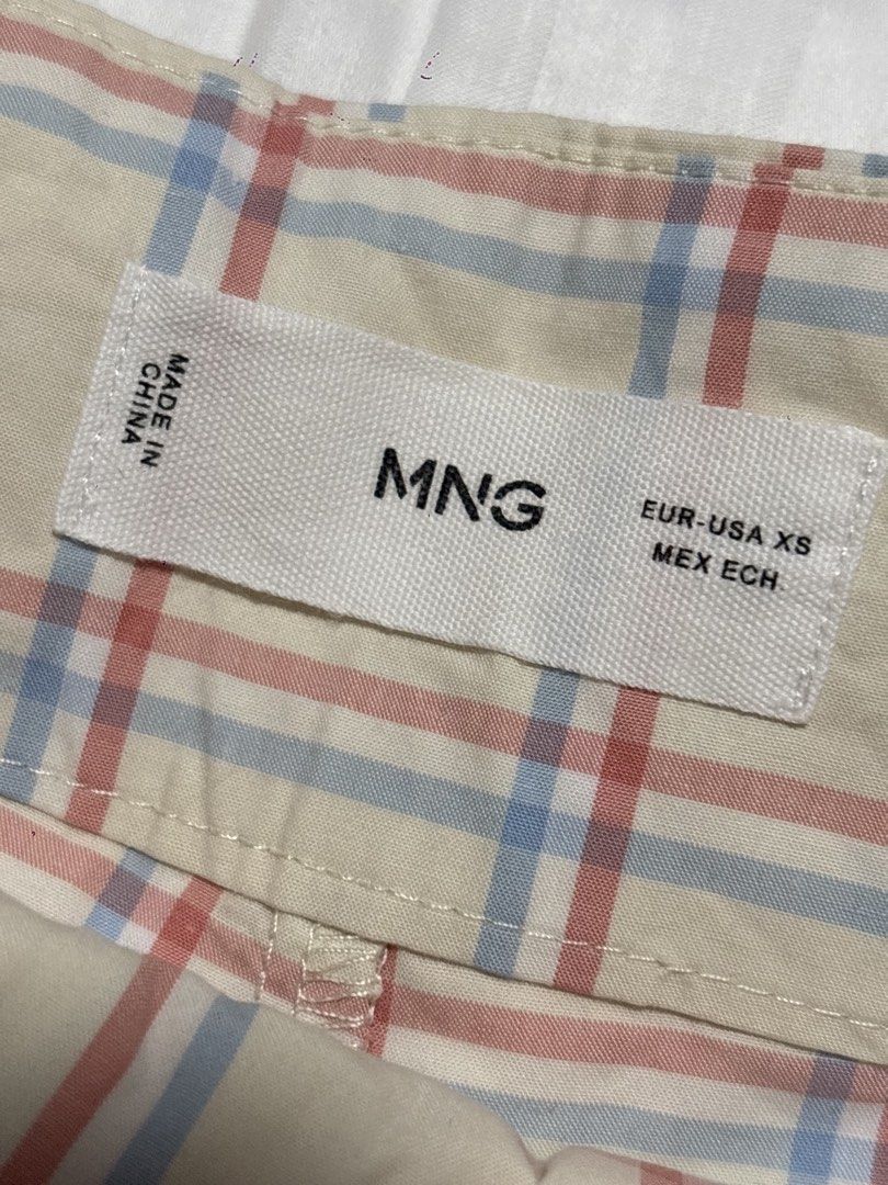 MNG Plaid Shorts XS (Category: Shorts) located in Pasay City. Submitted by nicoletlntn_ (Listing ID 1461236023, Image 2). Description: - Cream colored shorts - Red and blue plaid pattern - Button and zip closure - Two front pockets - Two back pockets - Size XS.