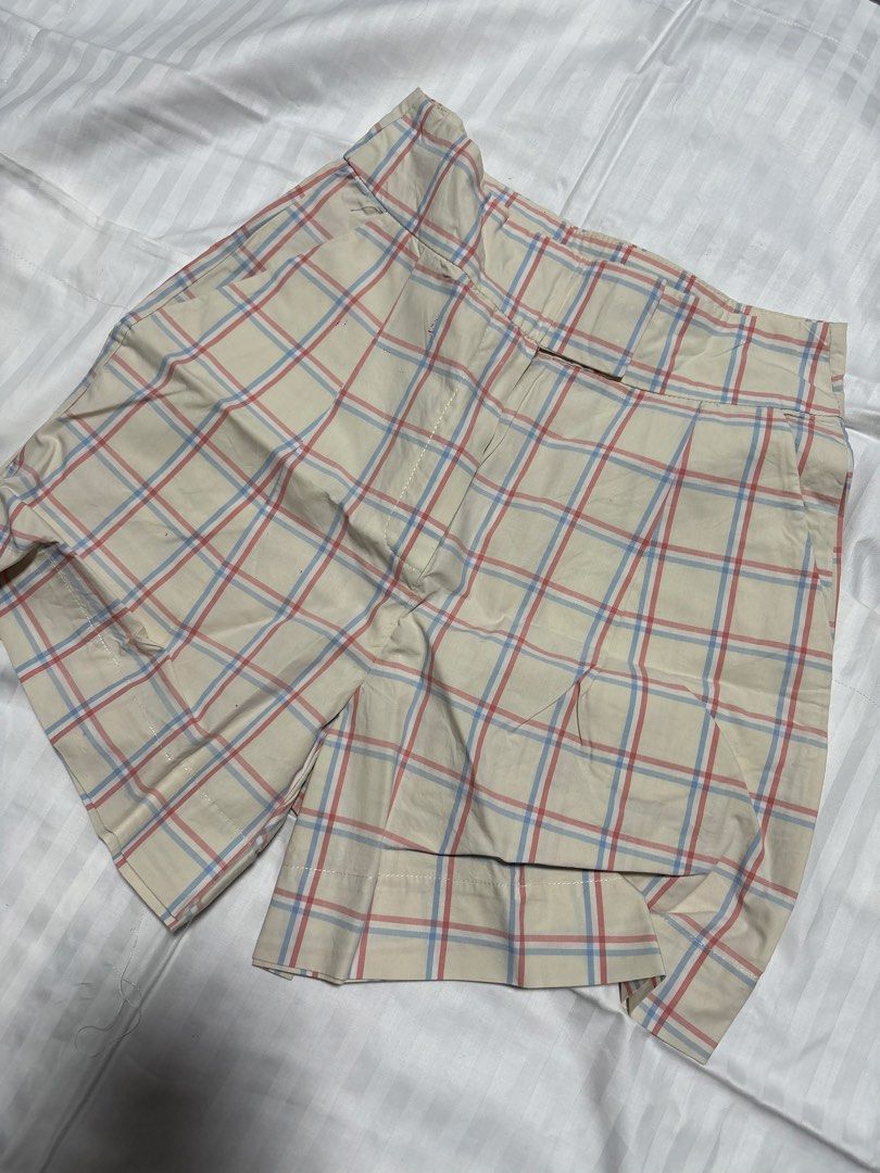 MNG Plaid Shorts XS (Category: Shorts) located in Pasay City. Submitted by nicoletlntn_ (Listing ID 1461236023, Image 1). Description: - Cream colored shorts - Red and blue plaid pattern - Button and zip closure - Two front pockets - Two back pockets - Size XS.