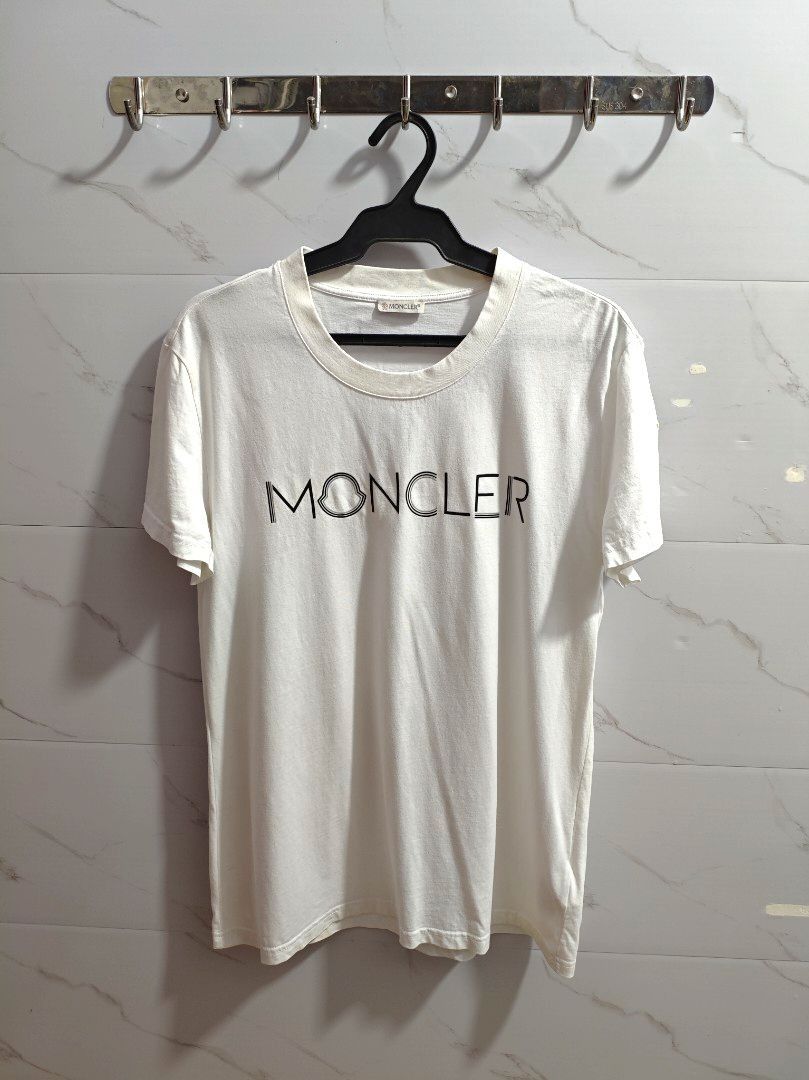 Moncler White Classic Unisex Tshirt (Category: Luxury Apparel) located in Baguio. Submitted by cool_chic (Listing ID 1456345959, Image 1). Description: Moncler White Classic Unisex Tshirt Color Rate 9.5/10 Like New Complete Tags Makapal Tela Machine Washed Size Medium Dimes 20 Width 28 Length Price P899.