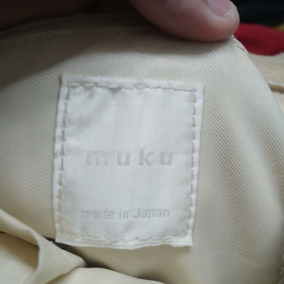 MUKU Knit & Shearling Mini Backpack (Category: Backpacks) located in Cagayan de Oro. Submitted by susanthrifts (Listing ID 1461246011, Image 3). Description: ​Brand: muku (Made in Japan) ​Item: Cable-knit & shearling drawstring mini backpack ​Color: Cream / Off-white (beige straps) ​Design Details: Real shearling front flap with buckle, thick cable-knit body, side drawstring tassels, adjustable thin straps. Super cute aesthetic for winter/cozy ou