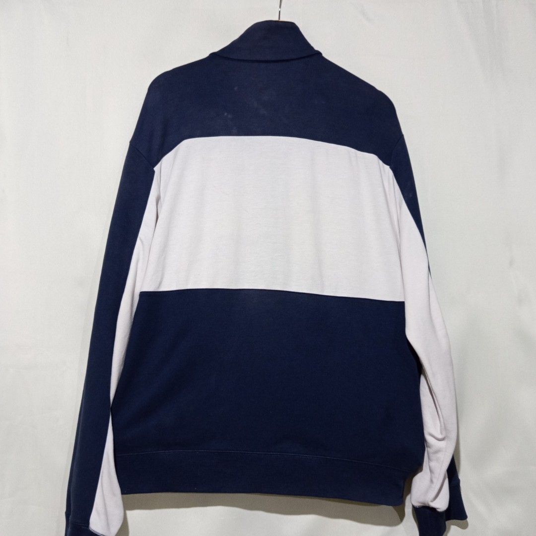 Navy Blue and White Zip-Up Track Jacket (Category: Coats, Jackets and Outerwear) located in Caloocan City. Submitted by anghelou (Listing ID 1461277269, Image 2). Description: - Navy blue cotton track jacket - White and blue design - Full zip-up front with stand-up collar - Two side pockets with zippers - With visible minor stains * You can dm me to send you other photos/videos for checking the condition..