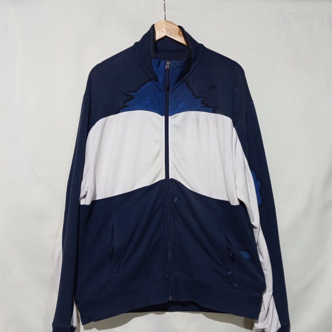 Navy Blue and White Zip-Up Track Jacket (Category: Coats, Jackets and Outerwear) located in Caloocan City. Submitted by anghelou (Listing ID 1461277269, Image 1). Description: - Navy blue cotton track jacket - White and blue design - Full zip-up front with stand-up collar - Two side pockets with zippers - With visible minor stains * You can dm me to send you other photos/videos for checking the condition..