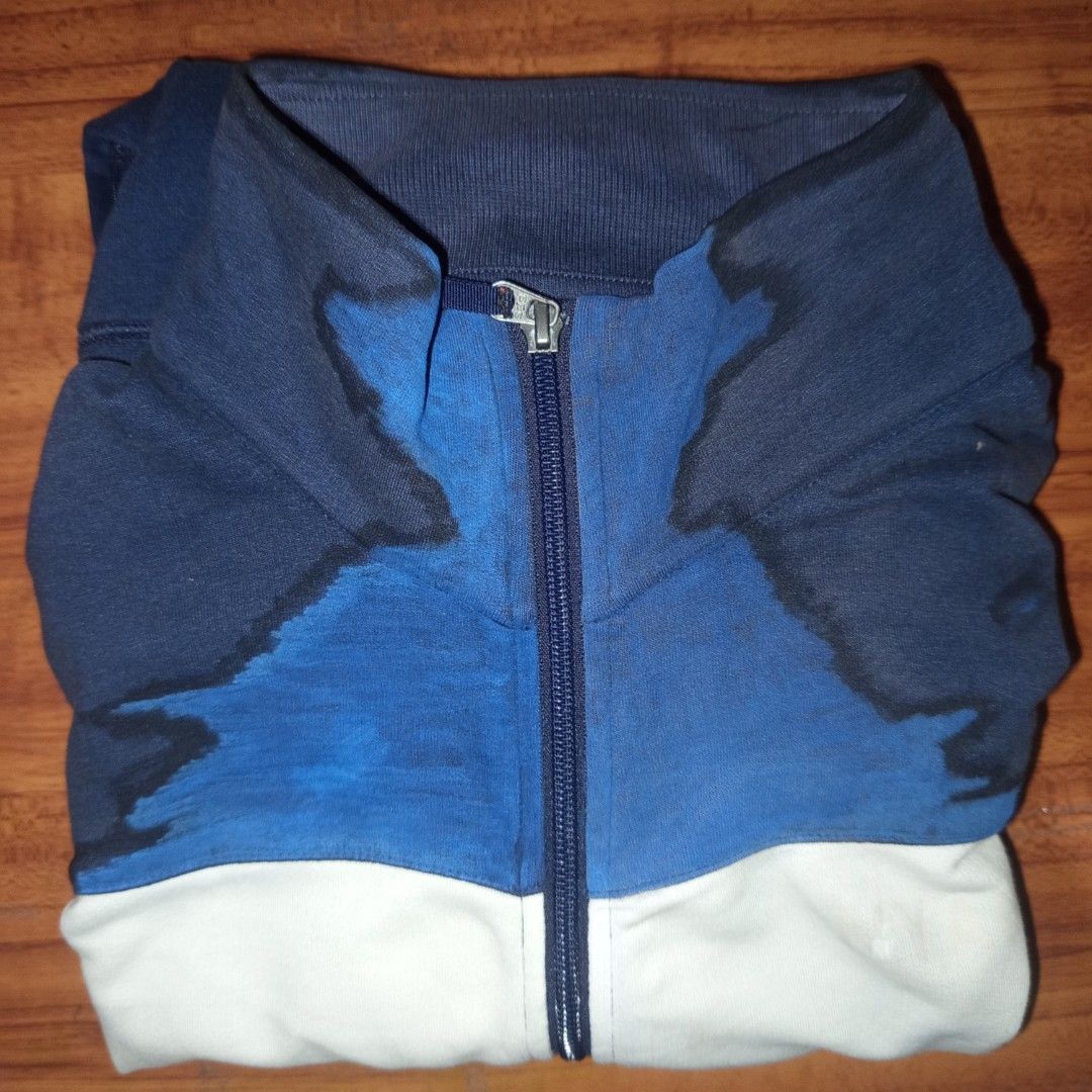 Navy Blue and White Zip-Up Track Jacket (Category: Coats, Jackets and Outerwear) located in Caloocan City. Submitted by anghelou (Listing ID 1461277269, Image 3). Description: - Navy blue cotton track jacket - White and blue design - Full zip-up front with stand-up collar - Two side pockets with zippers - With visible minor stains * You can dm me to send you other photos/videos for checking the condition..