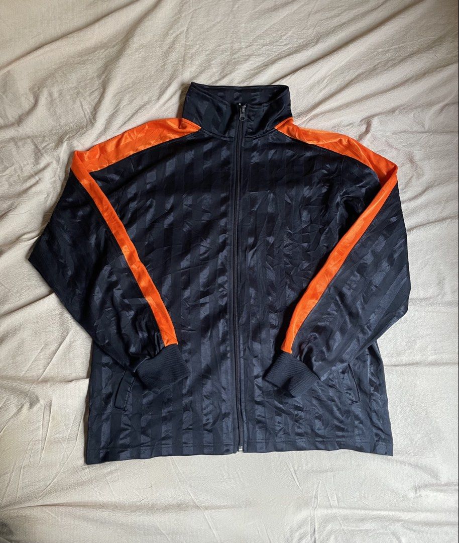 Navy Orange Striped Track Jacket (Category: Coats, Jackets and Outerwear) located in Manila. Submitted by stepsole (Listing ID 1461155076, Image 1). Description: - Cool navy track jacket - Orange accents on shoulders and sleeves - All-over vertical stripe pattern - Full zip front closure - Ribbed cuffs and hem for a snug fit - Ideal for casual wear or sports activities.