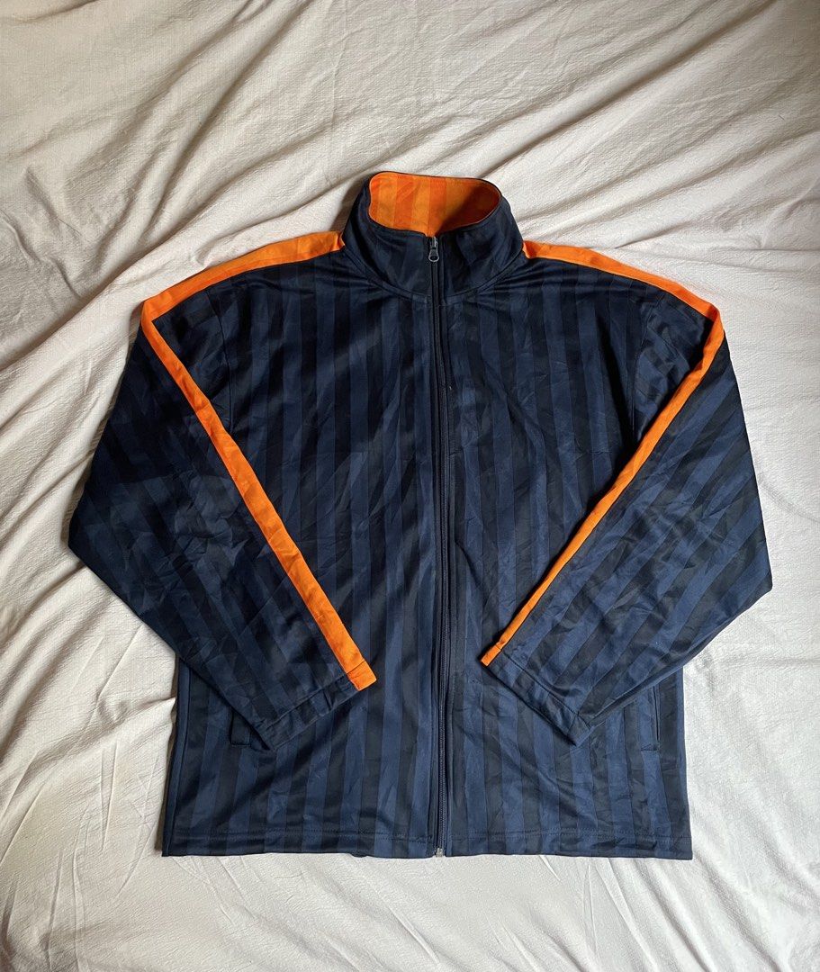 Navy Orange Striped Track Jacket (Category: Coats, Jackets and Outerwear) located in Manila. Submitted by stepsole (Listing ID 1461155076, Image 2). Description: - Cool navy track jacket - Orange accents on shoulders and sleeves - All-over vertical stripe pattern - Full zip front closure - Ribbed cuffs and hem for a snug fit - Ideal for casual wear or sports activities.
