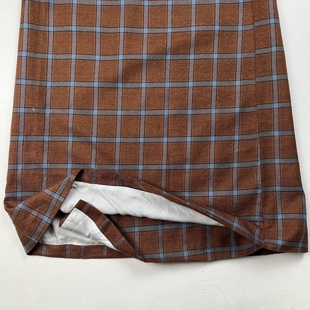 Needles Plaid Snap-Button Wrap Maxi Skirt (Category: Skirts) located in Quezon City. Submitted by forgarments (Listing ID 1461315612, Image 3). Description: Needles Plaid Snap-Button Wrap Maxi Skirt Good Condition - cut care labels / teared lining Size: 2 Waist: 27 Inches Hip: 19 Inches Length: 38 Inches Hem: 26 Inches A refined tailored piece from Keizo Shimizu’s Japanese imprint Needles, crafted in a structured rust-brown wool blend patterned w