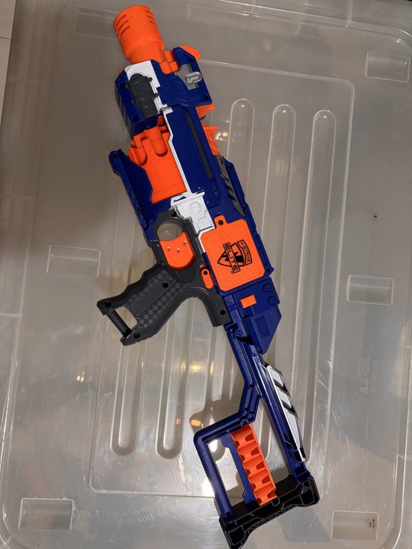 Nerf N-Strike Elite Stryfe Blaster Toy Gun (Category: Action & Battle Toys) located in Manila. Submitted by chicmom.of.3 (Listing ID 1461247923, Image 2). Description: - Blue and orange Nerf Stryfe blaster - Includes stock attachment - Great for kids' playtime or collectors - Fires darts quickly - Minor scuffs from use, still works well.