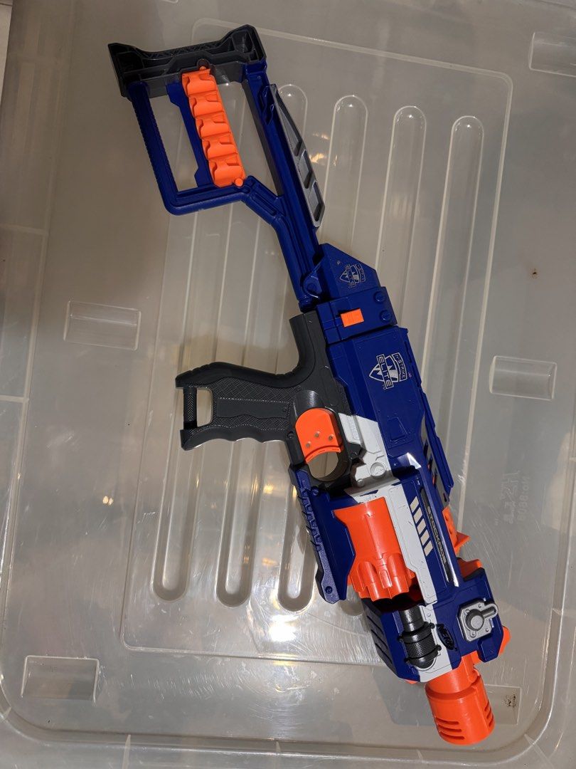 Nerf N-Strike Elite Stryfe Blaster Toy Gun (Category: Action & Battle Toys) located in Manila. Submitted by chicmom.of.3 (Listing ID 1461247923, Image 3). Description: - Blue and orange Nerf Stryfe blaster - Includes stock attachment - Great for kids' playtime or collectors - Fires darts quickly - Minor scuffs from use, still works well.