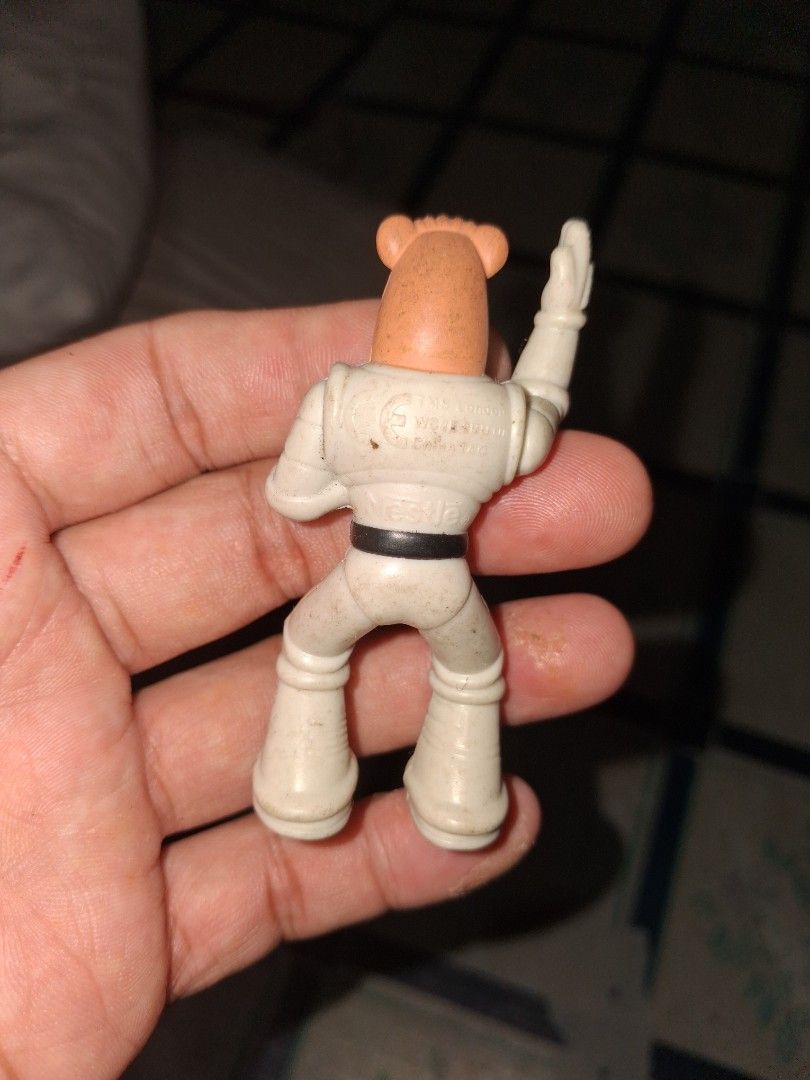 Nestle Space Astronaut Action Figure Toy (Category: Figurines & Statues) located in Manila. Submitted by marcas022798212 (Listing ID 1461265589, Image 2). Description: - Vintage Nestle Space Astronaut Toy - Made of durable plastic - Features articulated limbs for posing - Approximately 4 inches tall - Ideal for collectors or as a unique display piece.