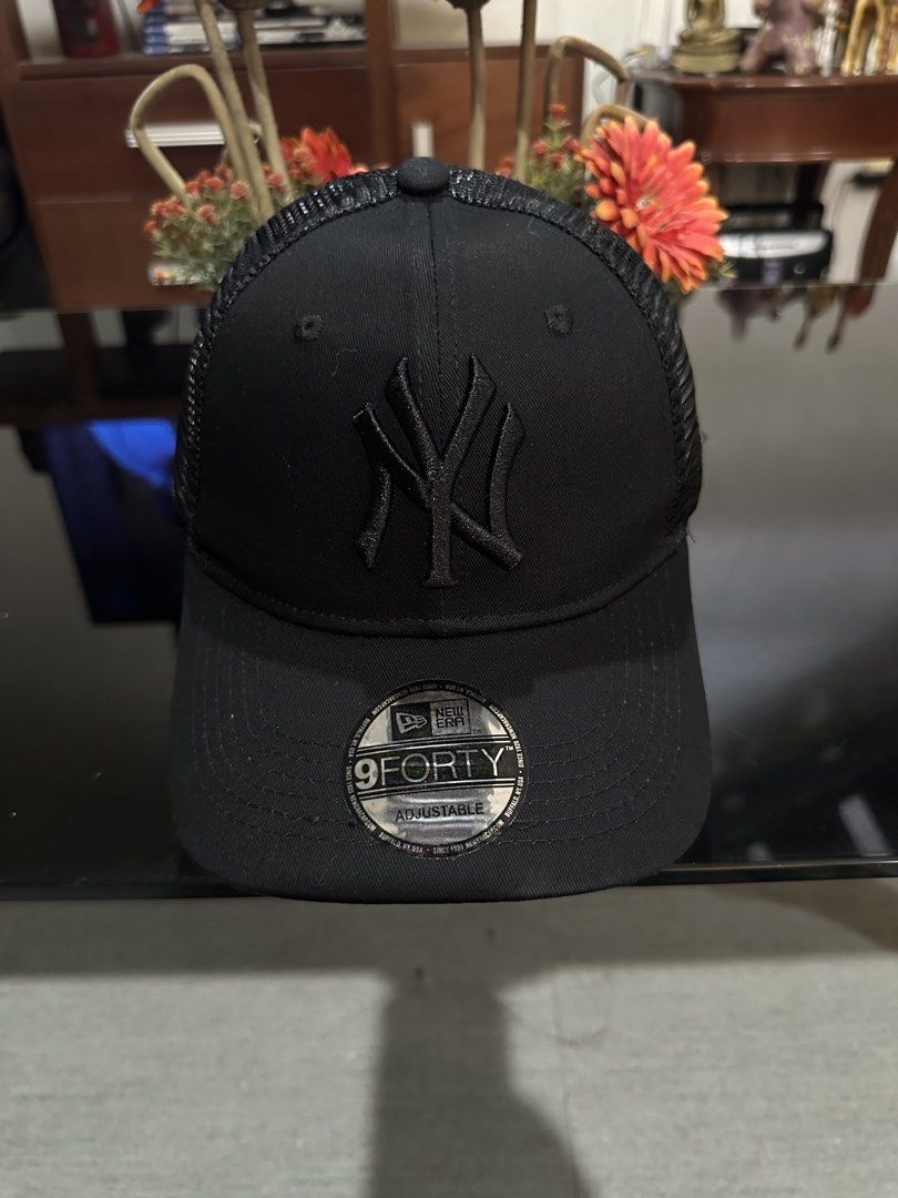 New Era 9FORTY Adjustable Black Mesh Cap (Category: Caps & Hats) located in Manila. Submitted by momsstore (Listing ID 1461133499, Image 2). Description: - Brand: New Era - Team: NY Yankees - Style: 9FORTY Adjustable Trucker Cap - Color: Black - Features: Embroidered logo on front, mesh back for breathability - Perfect for: Everyday wear.