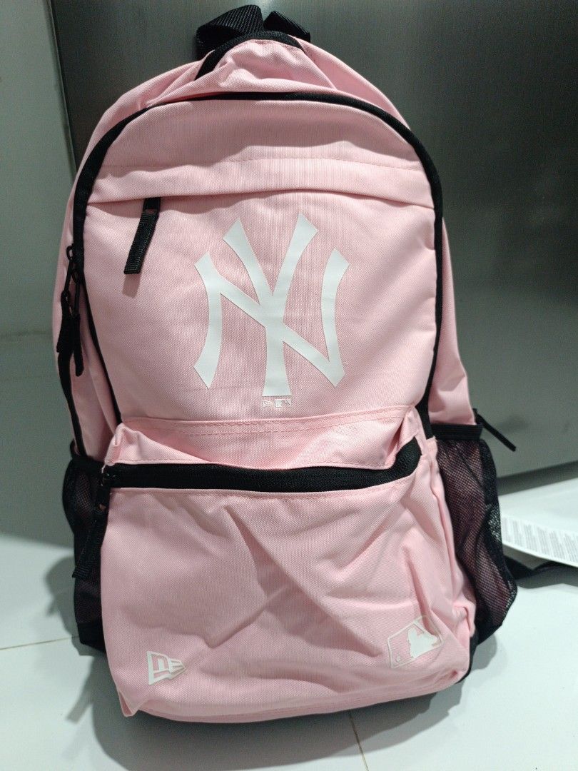 New Era Pink New York Yankees Backpack (Category: Backpacks) located in Binmaley. Submitted by dhebieboop09 (Listing ID 1461244755, Image 1). Description: - Pink New York Yankees backpack by New Era - Classic NY logo on the front - Front zip pocket for essentials - Side mesh pockets for water bottles or other items - Adjustable padded straps for comfortable carrying - Ideal for school, travel, or everyday use.