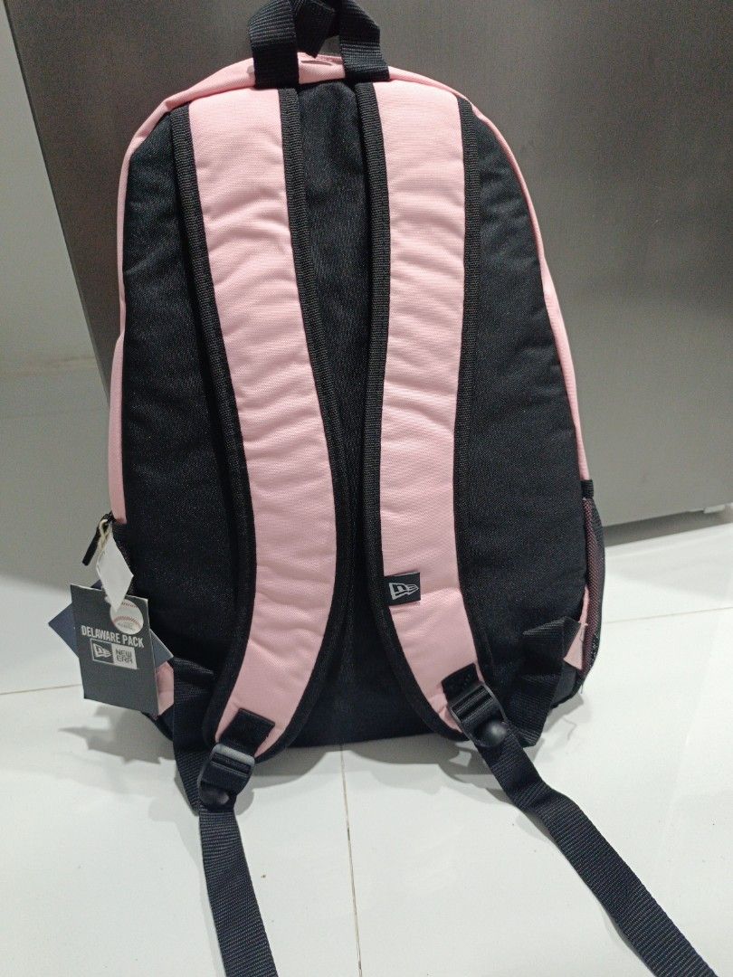 New Era Pink New York Yankees Backpack (Category: Backpacks) located in Binmaley. Submitted by dhebieboop09 (Listing ID 1461244755, Image 2). Description: - Pink New York Yankees backpack by New Era - Classic NY logo on the front - Front zip pocket for essentials - Side mesh pockets for water bottles or other items - Adjustable padded straps for comfortable carrying - Ideal for school, travel, or everyday use.