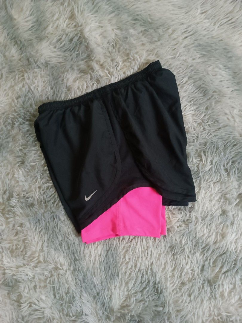 Nike 2 in 1 Training/Running Short (Category: Shorts) located in Mandaluyong City. Submitted by retro.199x (Listing ID 1461132254, Image 3). Description: SIZE SMALL ON TAG Waist: 26-34 Length: 10.5 Leg Opening: 12 EXCELLENT CONDITION.