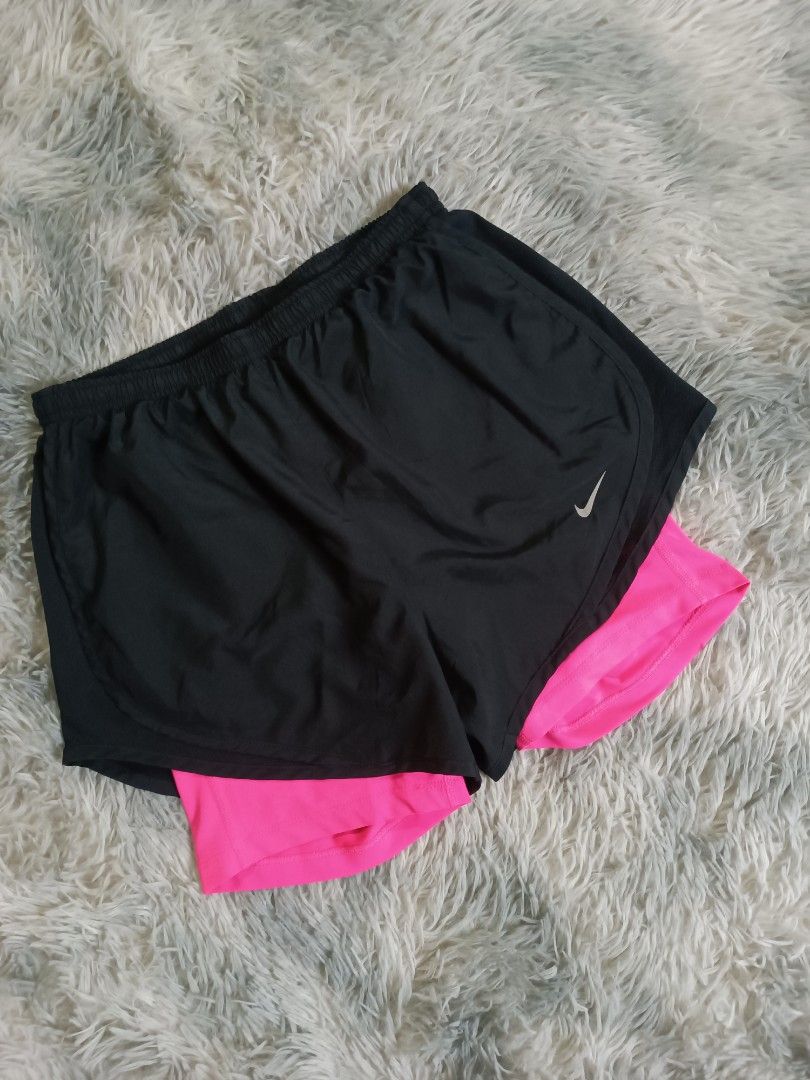 Nike 2 in 1 Training/Running Short (Category: Shorts) located in Mandaluyong City. Submitted by retro.199x (Listing ID 1461132254, Image 2). Description: SIZE SMALL ON TAG Waist: 26-34 Length: 10.5 Leg Opening: 12 EXCELLENT CONDITION.
