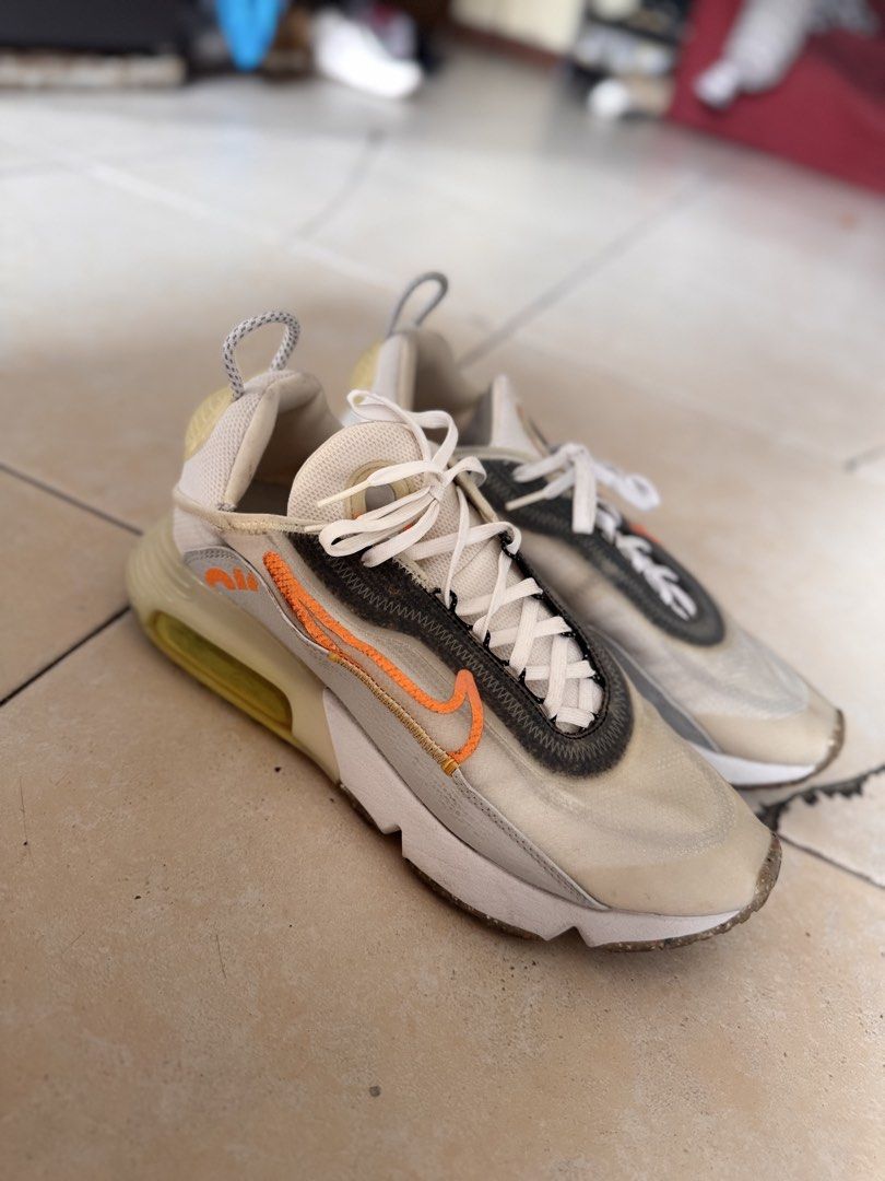 Nike Air Max 2090 Sneakers (Category: Casual Shoes) located in Manila. Submitted by grounders100 (Listing ID 1461183410, Image 2). Description: - Nike Air Max 2090 - Translucent upper with striking orange accents - Clean white laces - Shows some minor dirt on soles and toe box, adding character - Ideal for everyday wear and casual style.