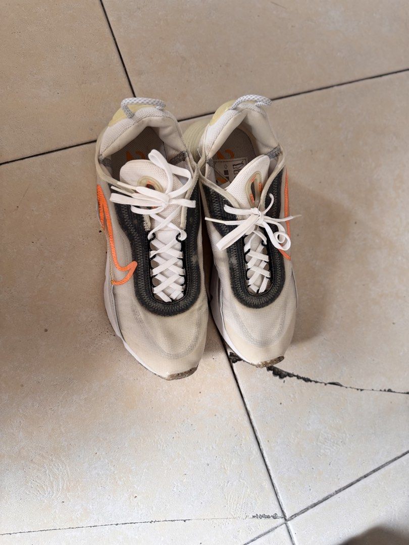 Nike Air Max 2090 Sneakers (Category: Casual Shoes) located in Manila. Submitted by grounders100 (Listing ID 1461183410, Image 1). Description: - Nike Air Max 2090 - Translucent upper with striking orange accents - Clean white laces - Shows some minor dirt on soles and toe box, adding character - Ideal for everyday wear and casual style.