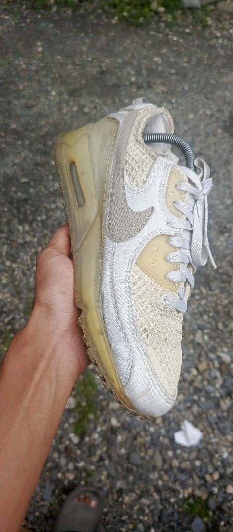 Nike Air Max 90 Sneakers (Category: Sneakers) located in Manila. Submitted by totiredtorunaway (Listing ID 1461237936, Image 2). Description: - Authentic Nike Air Max 90 - Passed Poizon authentication - Colorway: White and Beige - Upper: Mesh and Leather - Features visible Air unit in the sole - Minor yellowing on midsole and outsole - White laces - Nike branding on inner sole - Ideal for casual wear.