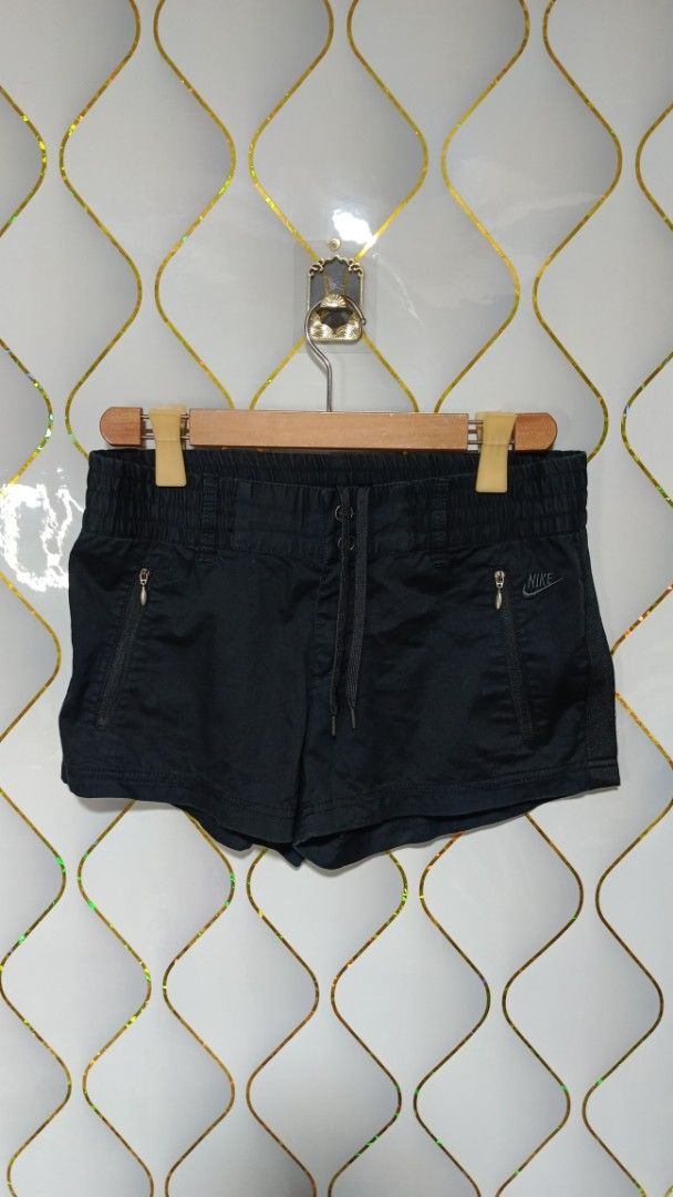 Nike Black Athletic Shorts with Zipper Pockets (Category: Shorts) located in Manila. Submitted by zariyah.1986 (Listing ID 1461239633, Image 1). Description: - Black Nike shorts - Elastic waistband with drawstring - Two zippered front pockets - Made from cotton and spandex blend - Comfortable and breathable material - Ideal for sports or casual wear -Size: Large on tag(32×11).