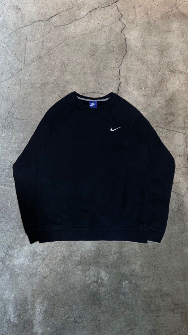 Nike Black Crewneck Sweatshirt (Category: Coats, Jackets and Outerwear) located in Manila. Submitted by _flipdd (Listing ID 1461299997, Image 1). Description: - Classic black Nike sweatshirt - Features iconic small swoosh logo on chest - Crewneck style with long sleeves - Comfortable and versatile for everyday wear - Great for layering.
