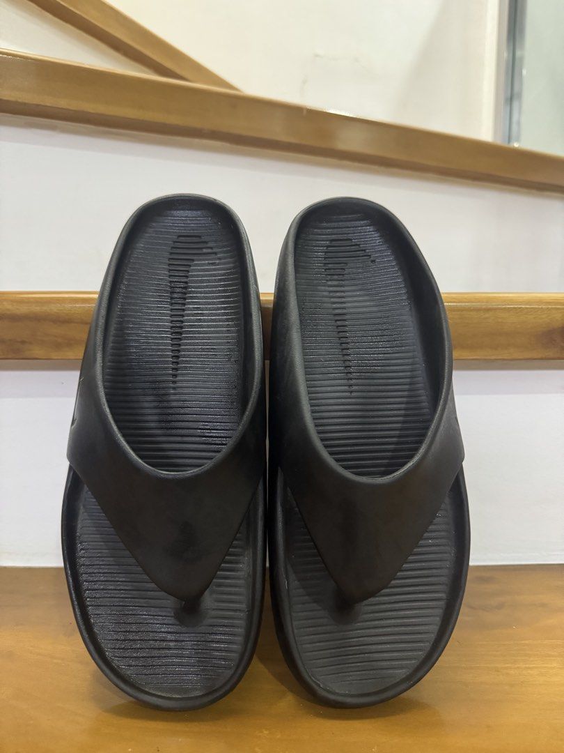 Nike Black Slides Sandals (Category: Slippers & Slides) located in Manila. Submitted by hachiichii617 (Listing ID 1461293951, Image 2). Description: - Black Nike slides - Comfortable and easy to wear - Embossed Nike logo on strap - Textured sole for enhanced grip - Ideal for casual outings, lounging, and everyday use.