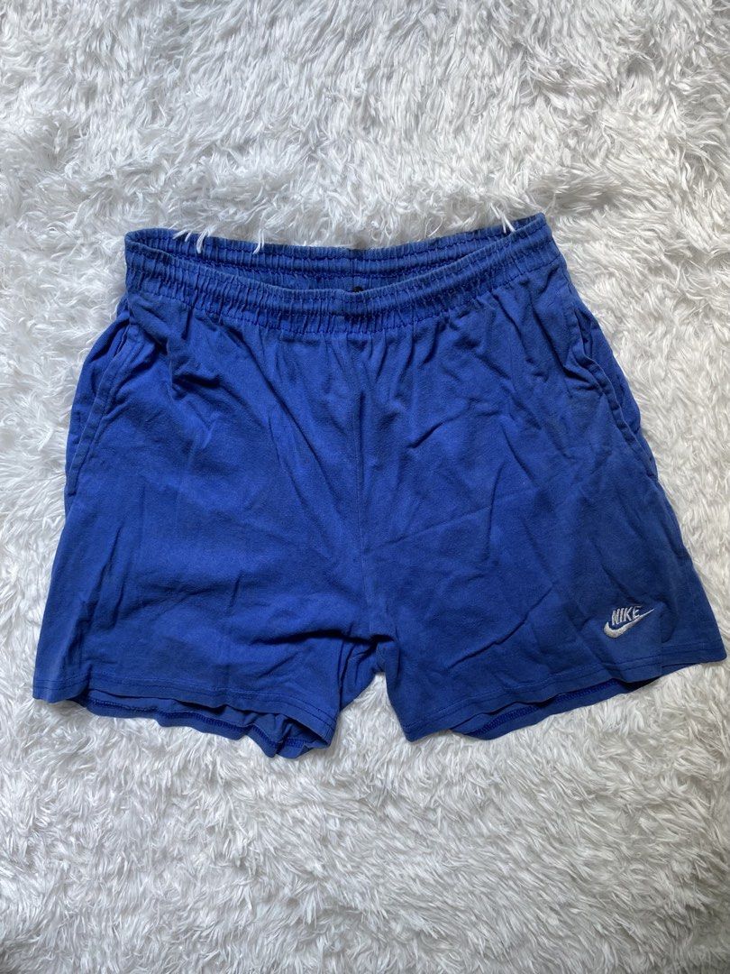Nike Blue Cotton Shorts Size S (Category: Shorts) located in Zamboanga. Submitted by trippsnthrifts (Listing ID 1461257943, Image 1). Description: - Blue Nike shorts - 100% Cotton - Elastic waistband with drawstring - Small embroidered Nike logo on left leg - Ideal for lounging or casual wear - Made in USA.