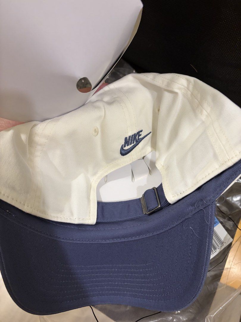 Nike Club Cap (Category: Caps & Hats) located in Mandaluyong City. Submitted by icheeellee (Listing ID 1461253324, Image 2). Description: Brand new Nike Club Cap - Color: Beige with Navy brim - Features embroidered 'Just do it' on the front - Nike logo on the back - Adjustable strap for a comfortable fit - Size: M/L (Adult) - Comes in original packaging.