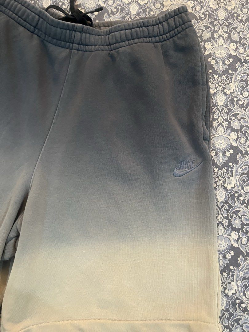 Nike Dip-Dye Sweat Shorts Size L (Category: Shorts) located in Batangas. Submitted by gavsandrix (Listing ID 1461145910, Image 2). Description: - Nike sweat shorts - Cool dip-dye effect (grey to off-white gradient) - Elastic waistband with drawstring - Comfortable cotton and polyester blend - Perfect for lounging or casual wear.