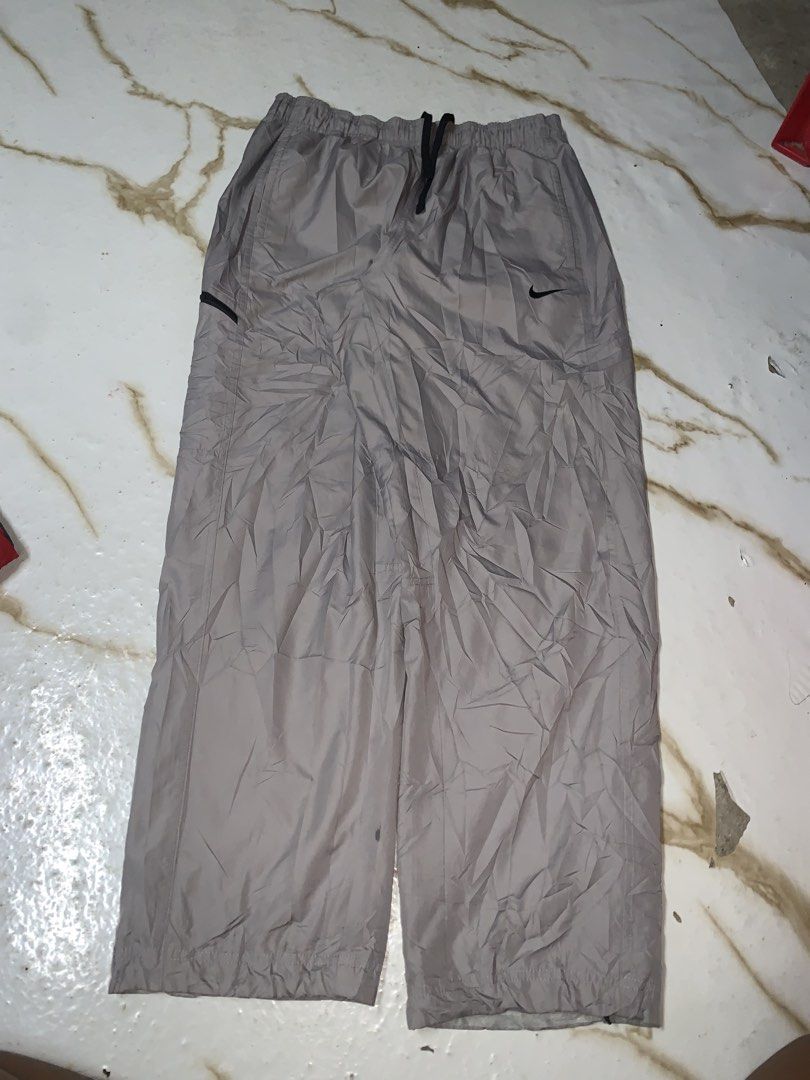 Nike Grey Polyester Nylon Track Pants Joggers Size XL (Category: Joggers) located in Iloilo. Submitted by johnpullan30303 (Listing ID 1461267289, Image 1). Description: - Grey Nike track pants - Made from polyester and nylon - Elastic waistband with drawstring - Size XL - Ideal for sports or casual wear - Please check photos for detailed condition.