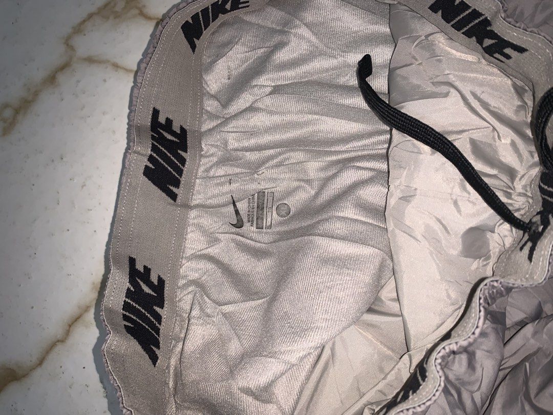 Nike Grey Polyester Nylon Track Pants Joggers Size XL (Category: Joggers) located in Iloilo. Submitted by johnpullan30303 (Listing ID 1461267289, Image 3). Description: - Grey Nike track pants - Made from polyester and nylon - Elastic waistband with drawstring - Size XL - Ideal for sports or casual wear - Please check photos for detailed condition.