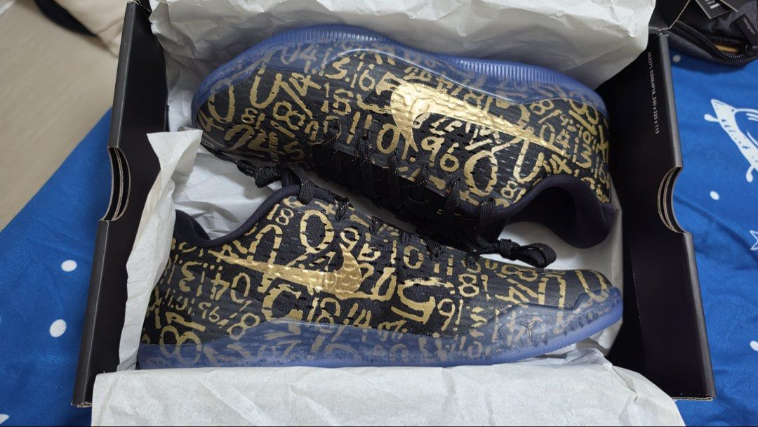 Nike Kobe XI EM Protro "Numbers" Black Gold (Category: Sneakers) located in Pasig City. Submitted by ayows (Listing ID 1461290294, Image 3). Description: Decluttering - gifted by my Tito, pero di kasi ako nagbabasketball HAHA - Nike Kobe XI EM Protro - Color: Black with gold numbers graphic - Sole: Translucent blue - Size: US Men's 10 - Condition: Comes with original box - Ideal for: Collectors and players.
