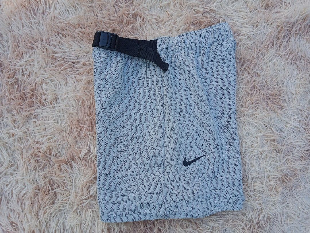 Nike Men's Grey Patterned Running Shorts Size M (Category: Shorts) located in Boston. Submitted by johnpaulvi30029 (Listing ID 1461277351, Image 1). Description: - Nike running shorts - Color: Grey with all-over pattern - Size: Medium (M) - Features: Elastic waistband with adjustable buckle belt - Origin: Made in China - Ideal for: Workouts, running, or casual wear.