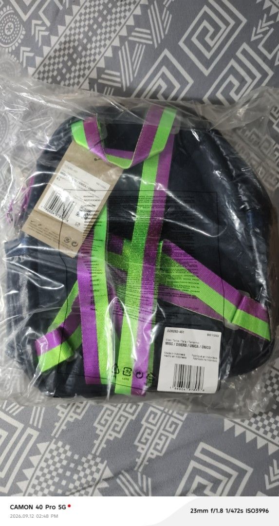 Nike Mini Backpack Navy Blue Pink Green (Category: Backpacks) located in Mandaluyong City. Submitted by swiftbird_ed6c34 (Listing ID 1461194883, Image 3). Description: - Cute mini backpack from Nike - Color: Navy blue with bright pink and green accents - Features a small front pocket - Ideal for carrying essentials - Brand new, still in original packaging.