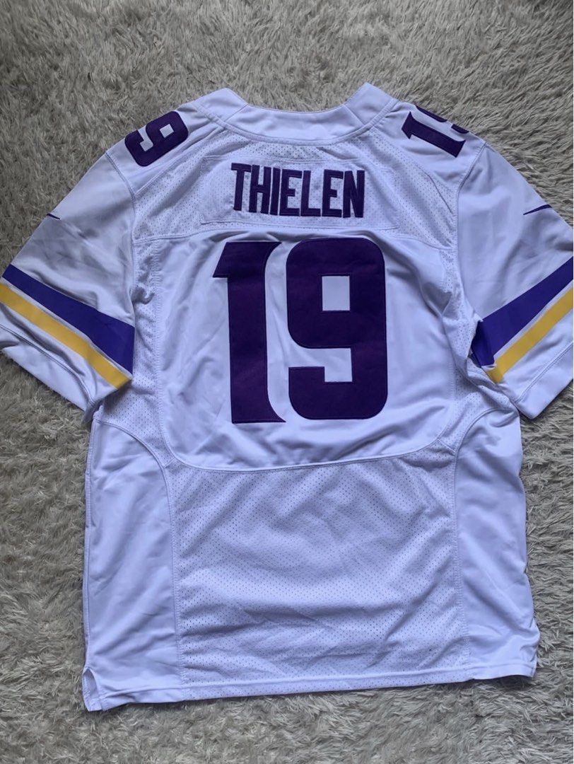 Nike Minnesota Vikings Adam Thielen Jersey #19 (Category: Activewear) located in General Santos City (Dadiangas). Submitted by thrifty_gsc (Listing ID 1461140310, Image 2). Description: - White Minnesota Vikings Jersey - Features Adam Thielen's name and number 19 - Purple and gold sleeve stripes - Nike and NFL branding - Size 52 - Ideal for any Vikings fan!.