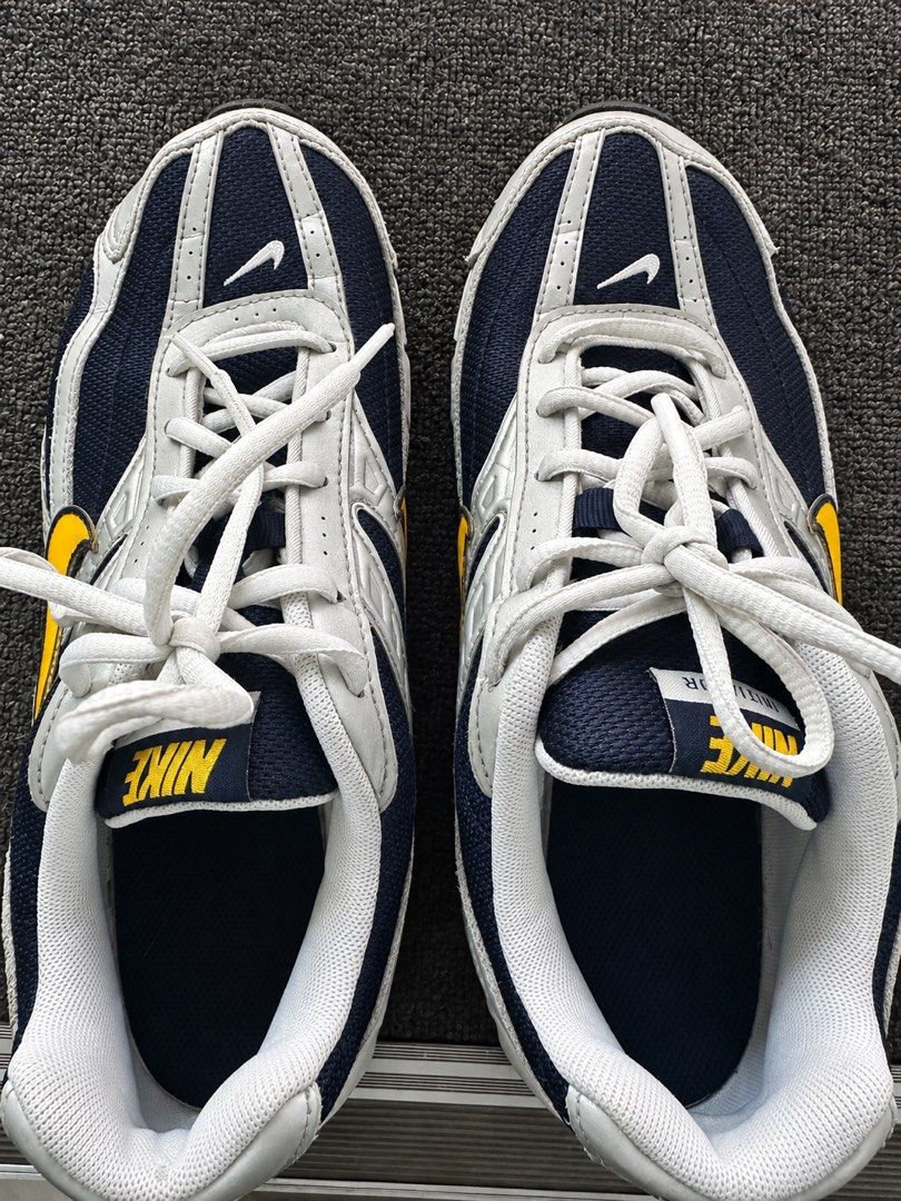 Nike Navy Blue Silver Yellow Running Shoes (Category: Sneakers) located in Manila. Submitted by aoparaiso (Listing ID 1461187772, Image 1). Description: - Classic Nike running shoes - Colorway: Navy blue, silver, and yellow - Closure: Lace-up for a secure fit - Ideal for: Everyday wear or light workouts - Features: Comfortable and stylish design.