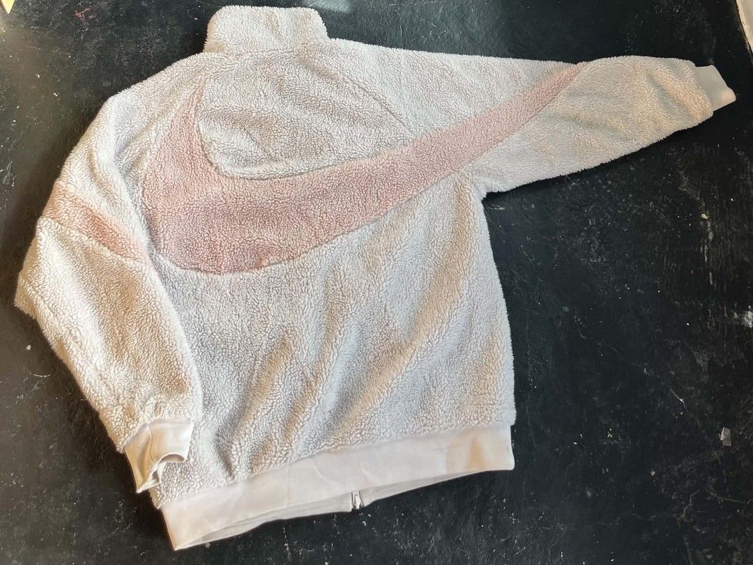 Nike Sherpa Fleece Reversible Jacket (Category: Coats, Jackets and Outerwear) located in San Jose del Monte. Submitted by smoothdealph12 (Listing ID 1461306512, Image 2). Description: - Super cozy Nike sherpa fleece jacket - Reversible design: sherpa fleece on one side, smooth nylon on the other - Iconic Nike swoosh logo - Perfect for staying warm and stylish - Size: Large (L) - Made in Vietnam.