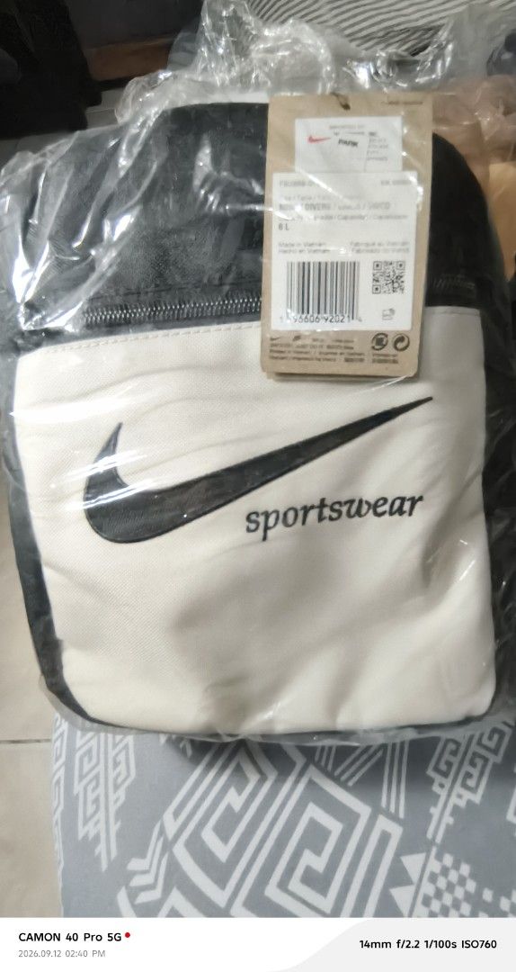 Nike Sportswear Small Backpack Black Cream (Category: Backpacks) located in Mandaluyong City. Submitted by swiftbird_ed6c34 (Listing ID 1461193638, Image 2). Description: - Classic black and cream Nike backpack - Iconic Nike swoosh and 'sportswear' branding - Convenient small front zip pocket - Adjustable straps for a comfortable fit - Ideal for everyday essentials or travel needs.