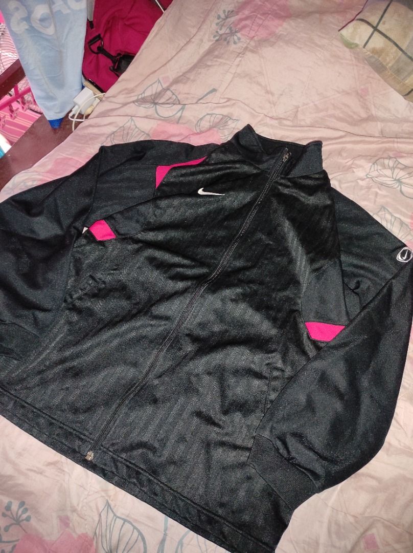 Nike Track Jacket Black red (Category: Coats, Jackets and Outerwear) located in Caloocan City. Submitted by jerry.coja14 (Listing ID 1461171522, Image 1). Description: - Black Nike track jacket - Pink accent details - Full zip closure - Nike swoosh logo on chest - Small Nike logo detail on sleeve - Great for workouts or casual wear.