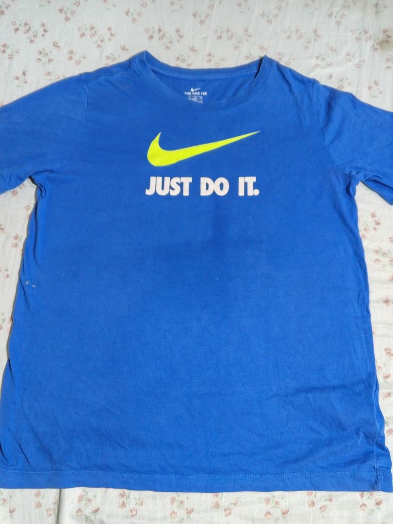 Nike T-shirt Blue Just Do It (Category: Tshirts & Polo Shirts ) located in Caloocan City. Submitted by nebs_seller (Listing ID 1461220872, Image 1). Description: - Classic blue Nike t-shirt - Features iconic swoosh logo - Includes 'Just Do It' slogan - Made from comfortable cotton material - Ideal for casual outings or workouts - Versatile: pairs easily with jeans or shorts.