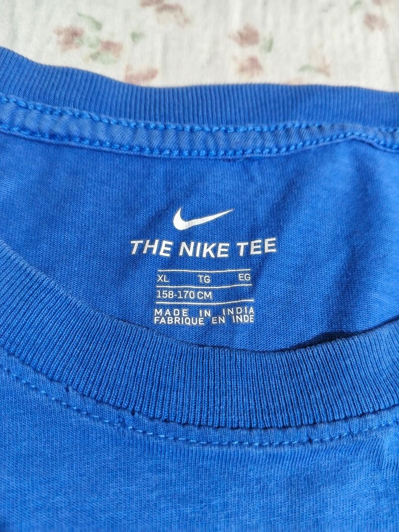 Nike T-shirt Blue Just Do It (Category: Tshirts & Polo Shirts ) located in Caloocan City. Submitted by nebs_seller (Listing ID 1461220872, Image 2). Description: - Classic blue Nike t-shirt - Features iconic swoosh logo - Includes 'Just Do It' slogan - Made from comfortable cotton material - Ideal for casual outings or workouts - Versatile: pairs easily with jeans or shorts.