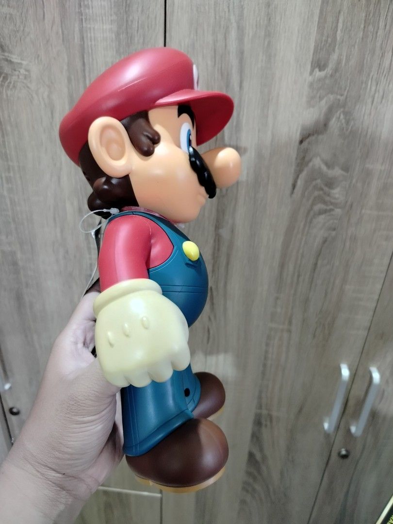 Nintendo Super Mario Bros. Talking Action Figure (Category: Figurines & Statues) located in Quezon City. Submitted by marcplusclein (Listing ID 1461147699, Image 2). Description: - Large Nintendo Mario figure - Features classic red hat and blue overalls - Ideal for any Mario fan - Great size for playing or displaying.
