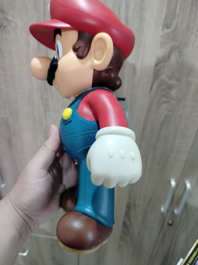 Nintendo Super Mario Bros. Talking Action Figure (Category: Figurines & Statues) located in Quezon City. Submitted by marcplusclein (Listing ID 1461147699, Image 3). Description: - Large Nintendo Mario figure - Features classic red hat and blue overalls - Ideal for any Mario fan - Great size for playing or displaying.