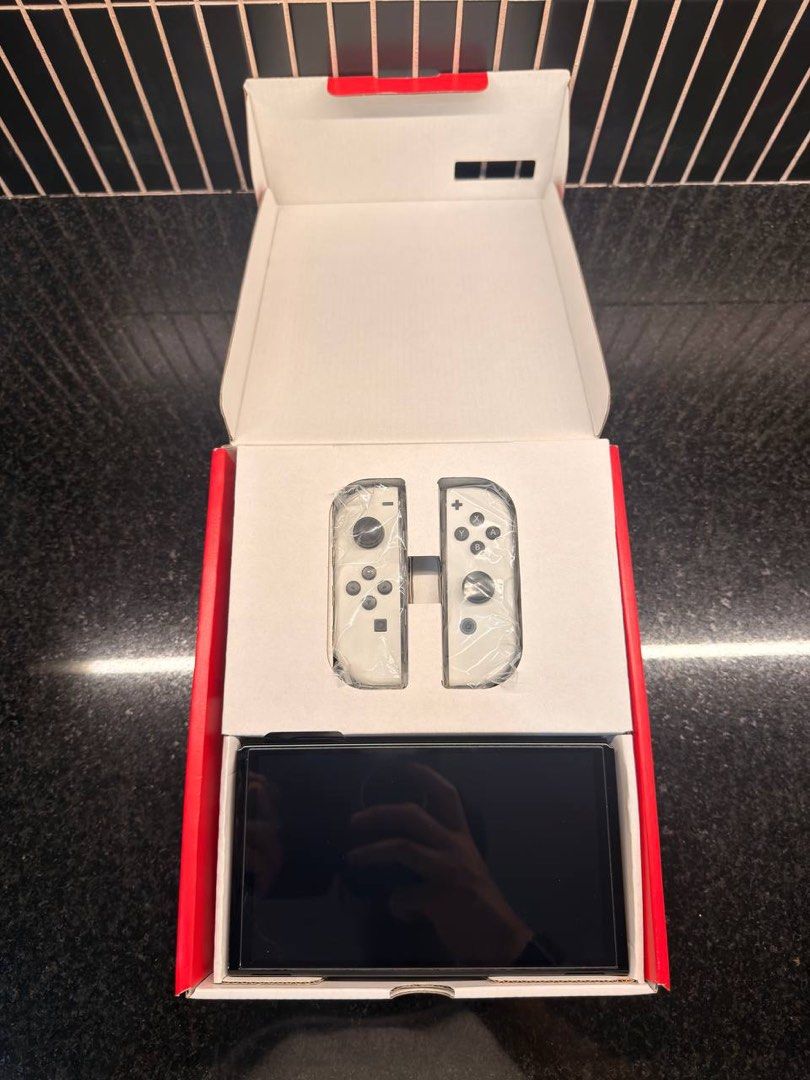 Nintendo Switch OLED Bundle (Category: Nintendo) located in Pasig City. Submitted by shop.rdm (Listing ID 1461139555, Image 2). Description: 🎮 Nintendo Switch OLED Bundle – Selling my Nintendo Switch OLED, in excellent condition and well taken care of. Fully functional with no known issues. Inclusions: • Nintendo Switch OLED console • Original box and packaging • Original accessories • Skull & Co. Rhino Glass Series Screen Protector – one (1) in