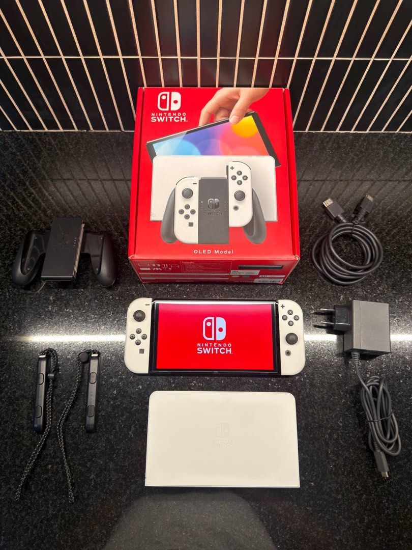 Nintendo Switch OLED Bundle (Category: Nintendo) located in Pasig City. Submitted by shop.rdm (Listing ID 1461139555, Image 3). Description: 🎮 Nintendo Switch OLED Bundle – Selling my Nintendo Switch OLED, in excellent condition and well taken care of. Fully functional with no known issues. Inclusions: • Nintendo Switch OLED console • Original box and packaging • Original accessories • Skull & Co. Rhino Glass Series Screen Protector – one (1) in