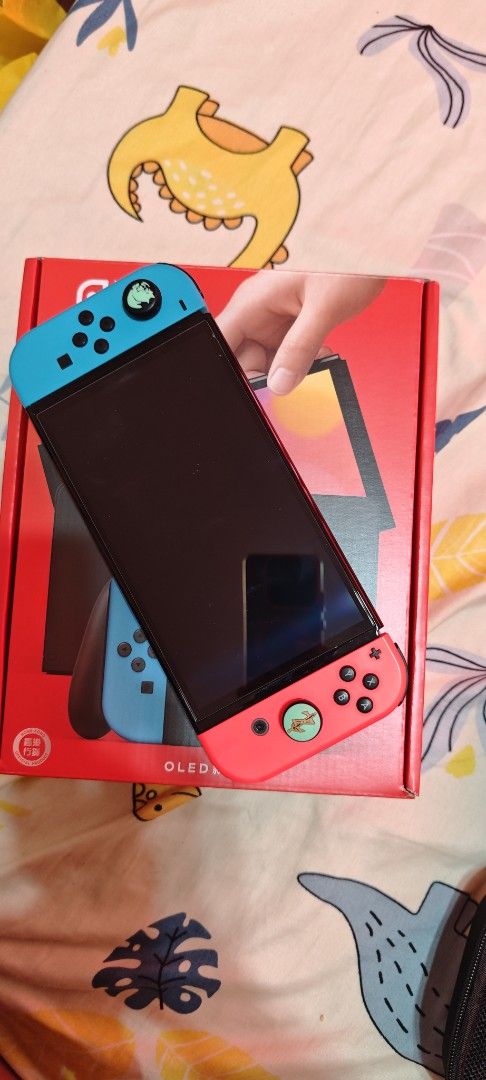 Nintendo Switch OLED Model Console with Neon Red/Blue Joy-Cons (Category: Nintendo) located in Manila. Submitted by she1026 (Listing ID 1461166824, Image 3). Description: - Nintendo Switch OLED Model - Neon Red & Blue Joy-Cons included - Original box included - Ready for home or on-the-go gaming.