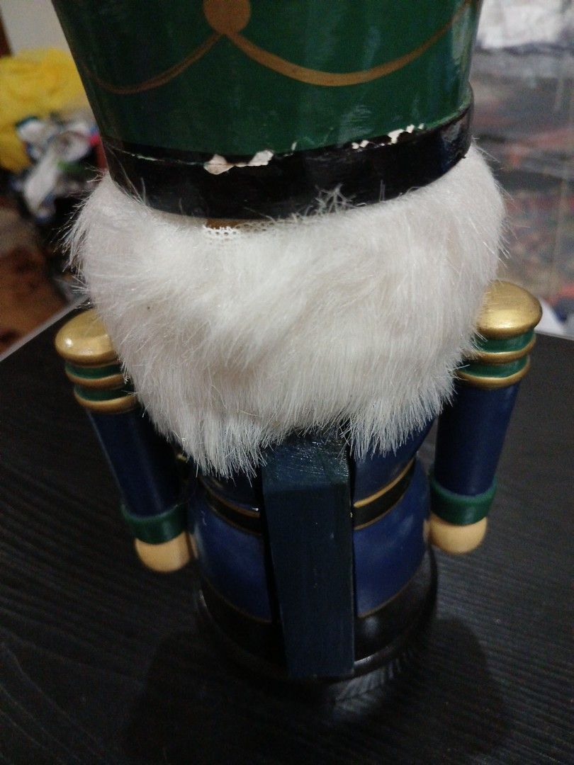 Nutcracker (Category: Other Home Decor) located in Davao. Submitted by ferdipt (Listing ID 1461134918, Image 3). Description: A wooden nutcracker soldier figurine in a blue coat with green and gold accents..