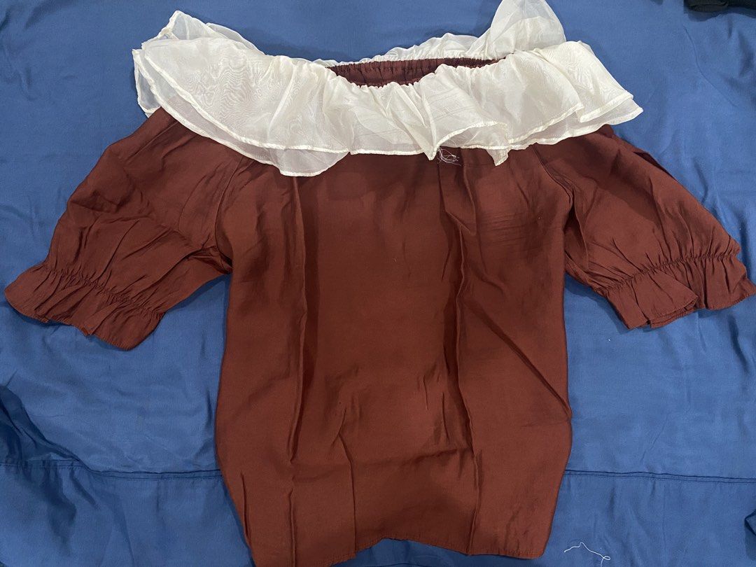 Off-Shoulder Ruffle Top - Brown & Cream (Category: Blouses) located in Manila. Submitted by escherichiaa (Listing ID 1461294672, Image 2). Description: - Cute off-shoulder top - Brown body with cream ruffle neckline - Puff sleeves with elastic cuffs - Versatile: pairs well with jeans or shorts - Ideal for casual day outs or nights with friends - A stylish addition to your wardrobe.
