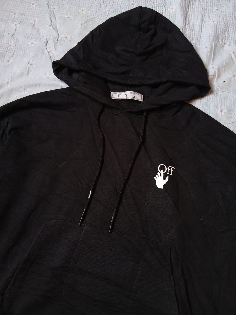 OFF-WHITE "CUT HERE" Arrows Hoodie Black (Category: Hoodies) located in Caloocan City. Submitted by youngmoon_51e2c6 (Listing ID 1461213621, Image 2). Description: - Authentic Black OFF-WHITE hoodie - Iconic OFF-WHITE arrows graphic on the back - Unique 'CUT HERE' detail on the back - Small hand logo on the front chest - Adjustable drawstrings for the hood - Convenient kangaroo pocket - Tag reads 'White™ Main'.