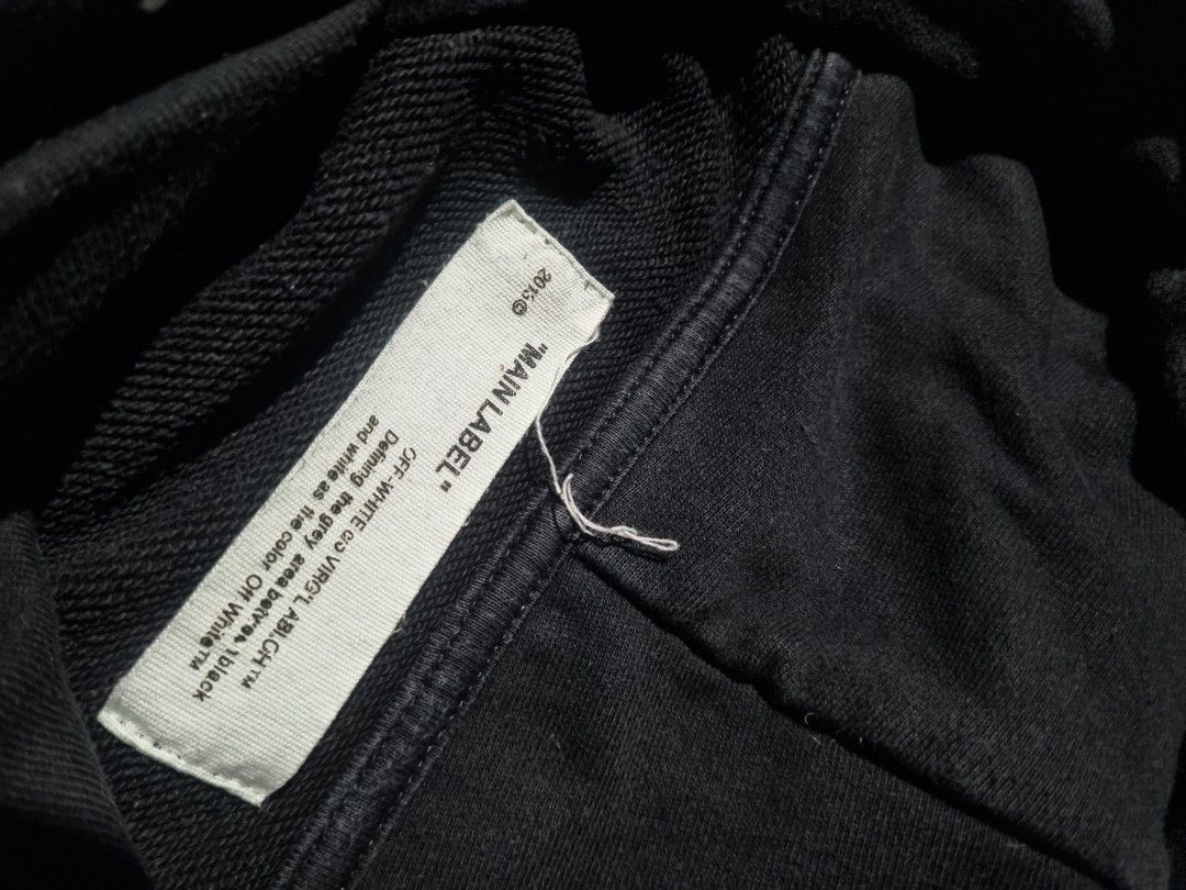 OFF-WHITE "Global Warming?" Cherry Blossom Hoodie (Category: Hoodies) located in Manila. Submitted by ja_thrift. (Listing ID 1461241434, Image 3). Description: - Authentic Black OFF-WHITE Hoodie - Features striking cherry blossom graphics on sleeves and back - 'Global Warming?' text prominently displayed on the front hem - Iconic 'OFF' logo on the chest - Tag details: 'MAIN LABEL' and '2015' collection.